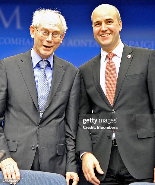 Herman Van Rompuy, Belgium's prime minister, and the first president of Europe, left, stands with Fredrik Reinfeldt, Sweden's prime minister and...