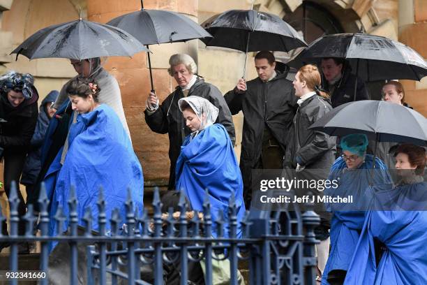 Cast and crew from the TV series Outlander arrive at a filming location at St Andrew's Square on March 15, 2018 in Glasgow, Scotland. Dozens of fans...