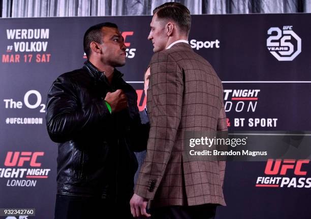 Fabricio Werdum of Brazil and Alexander Volkov of Russia face off during the UFC Fight Night Ultimate Media Day in Glaziers Hall on March 15, 2018 in...