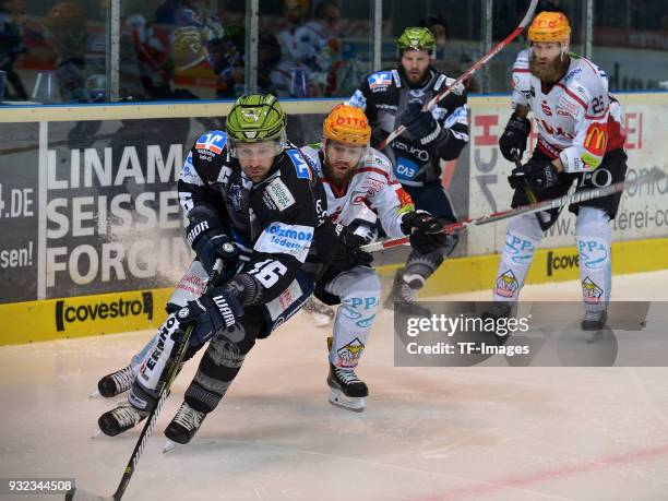 Jason Jaspers of Iserlohn and Wade Bergman of Bremerhaven battle for the ball during the DEL match between Iserlohn Roosters and Fischtown Pinguins...