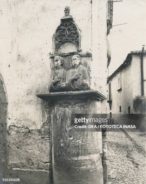 Relief depicting two men wearing togas inset on a corner wall of Casa Cardone, Teatro Romano, Benevento, Campania, Italy, photograph from Istituto...