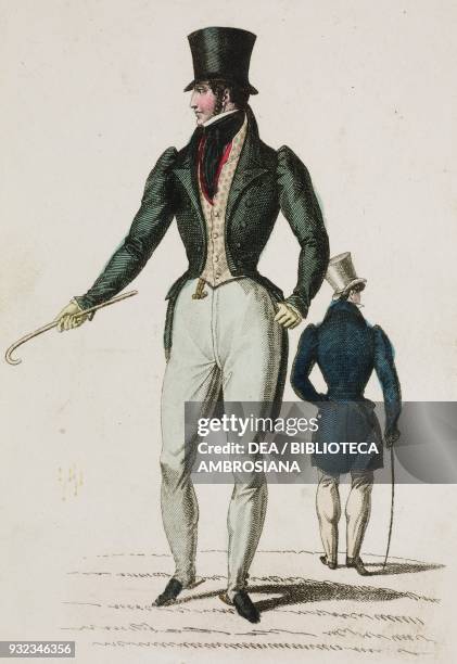 Man wearing a walking suit with unmatched jacket and trousers consisting of light-coloured trousers, dark jacket, waistcoat and scarf, top hat and...