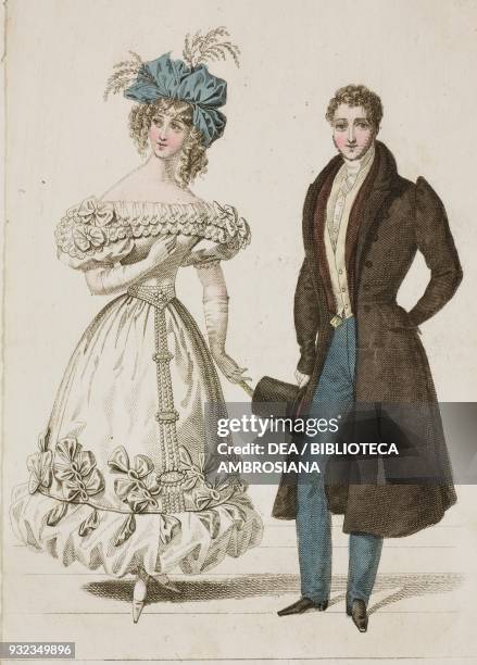 Woman wearing an elegant white dress with puffed sleeves, decorated with bows and embroidery and a blue hat, man wearing a formal suit with unmatched...