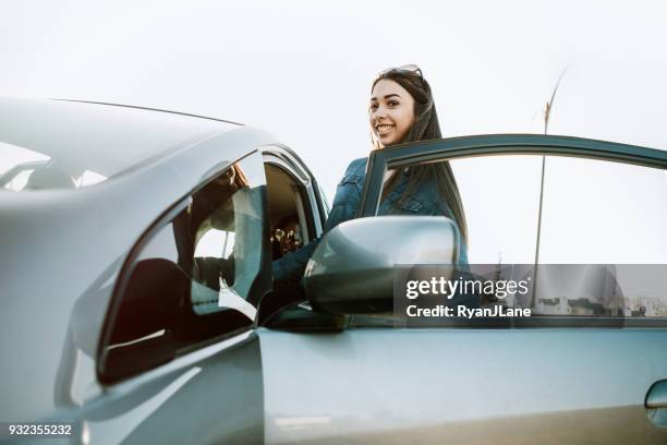 group of young adults having fun riding in car - learning to drive stock pictures, royalty-free photos & images