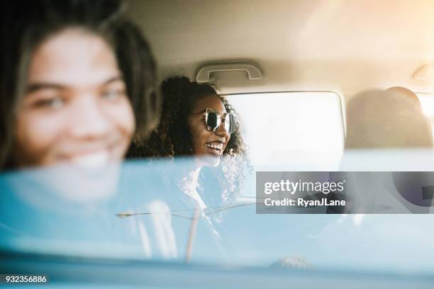 Group of Young Adults Having Fun Riding in Car