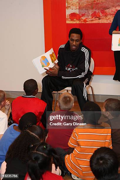 Brandon Jennings of the Milwaukee Bucks reads to students during the Read to Achieve event sponsored by the Bucks and the Sam's Hope Literacy...