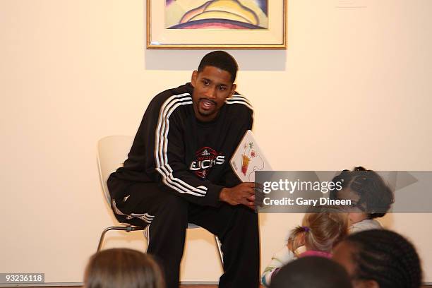 Charlie Bell of the Milwaukee Bucks reads to students during the Read to Achieve event sponsored by the Bucks and the Sam's Hope Literacy Foundation...