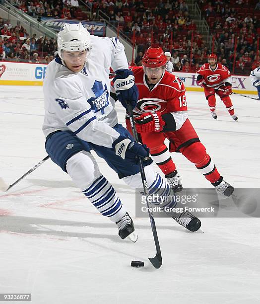 Luke Schenn of the Toronto Maple Leafs carries the puck during a NHL game against the Carolina Hurricanes on November 19, 2009 at RBC Center in...