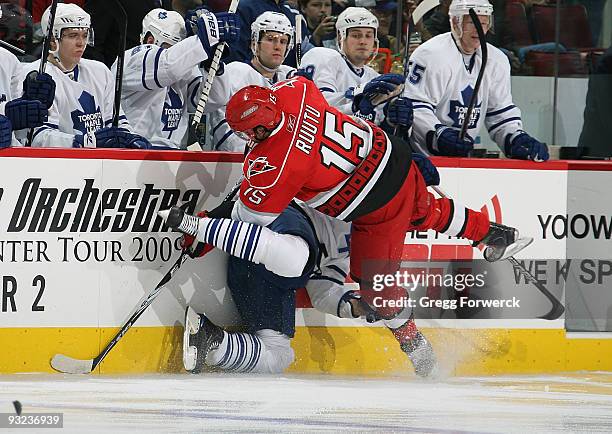 Tuomo Ruutu of the Carolina Hurricanes collides with a Toronto Maple Leafs player along the boards during a NHL game on November 19, 2009 at RBC...