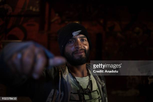 Homeless drug addict, Carlos, poses for a photo on a sidewalk in Bogota, Colombia on March 10, 2018. People without roof involves regular...