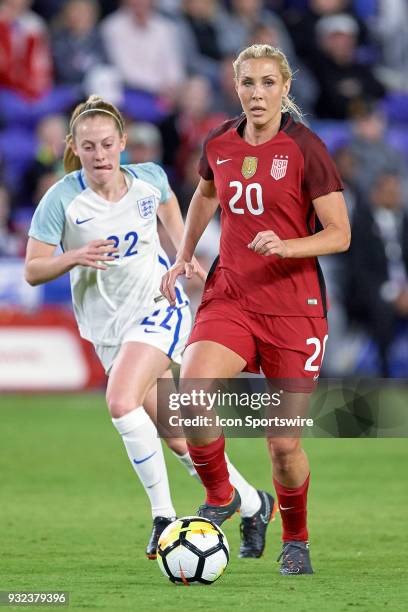 United States midfielder Allie Long dribbles the ball past England midfielder Keira Walsh during the SheBelieves Cup match between USA and England on...