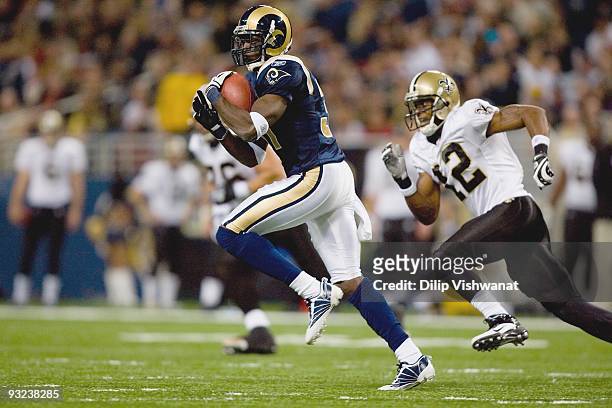 James Butler of the St. Louis Rams intercepts the ball against Marques Colston of the New Orleans Saints at the Edward Jones Dome on November 15,...