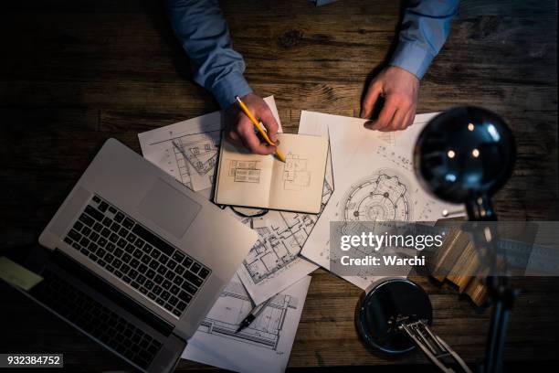 architect hand drawing at his desk - angle poise lamp stock pictures, royalty-free photos & images