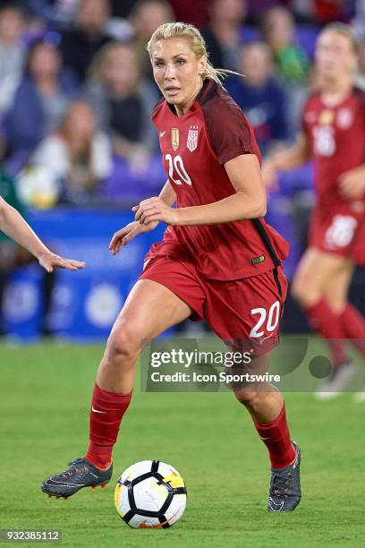 United States midfielder Allie Long dribbles the ball during the SheBelieves Cup match between USA and England on March 07 at Orlando City Stadium in...