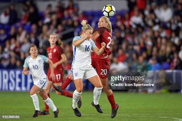 United States midfielder Allie Long battles with England midfielder Isobel Christiansen to head the ball during the SheBelieves Cup match between USA...