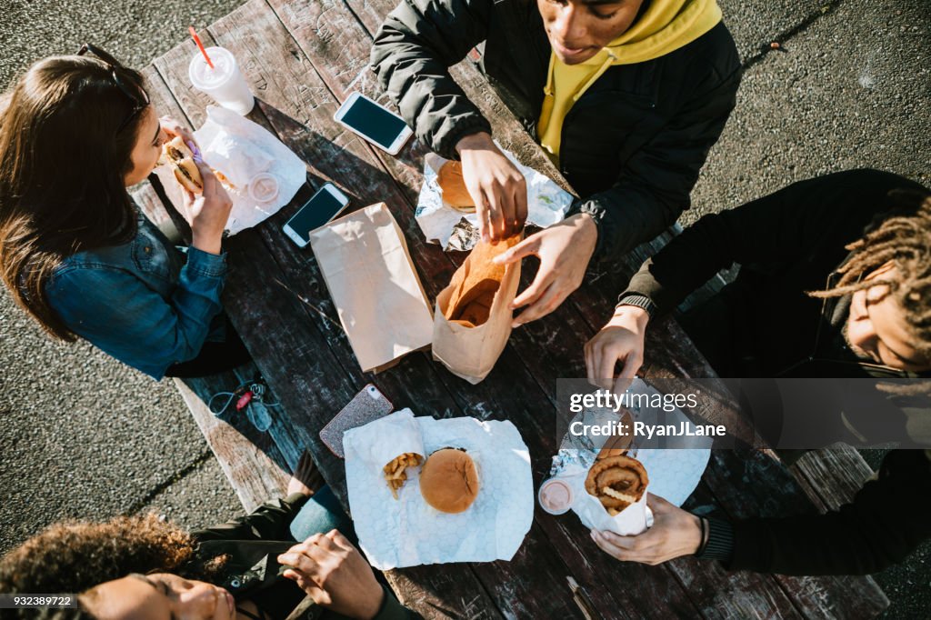Group of Young Adults Eating Fast Food
