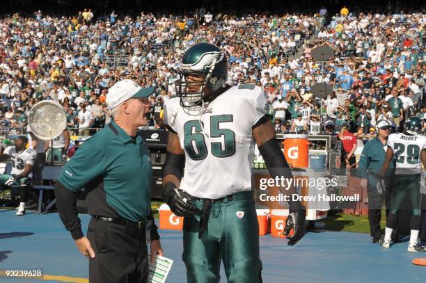 Coach Ted Daisher of the Philadelphia talks with offensive tackle King Dunlap Eagles during the game against the San Diego Chargers on November 15,...