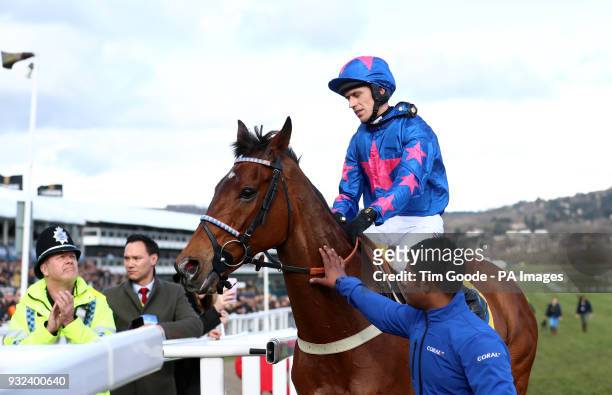 Cue Card and jockey Paddy Brennan after failing to finish the Ryanair Chase during St Patrick's Thursday of the 2018 Cheltenham Festival at...