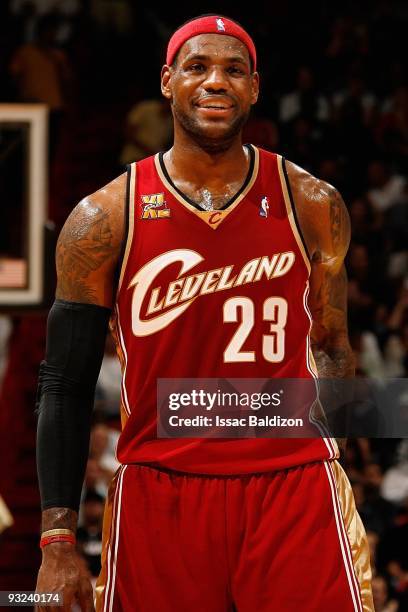 LeBron James of the Cleveland Cavaliers smiles on the court during the game against the Miami Heat on November 12, 2009 at American Airlines Arena in...