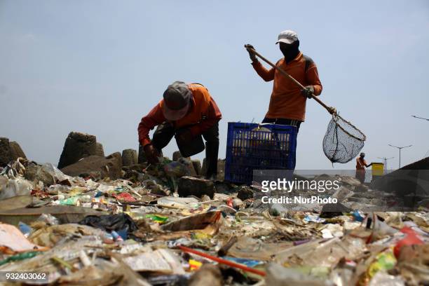Sanitary officers trying to clean up plastic waste from northern coast of Jakarta on Thursday, March 15, 2018. Based on research by Jenna Jambeck, a...