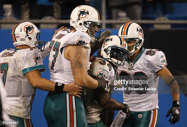 Chad Henne Jake Long, Ricky Williams and Greg Camarillo of the Miami Dolphins celebrate after Williams scored a 46 yard rushing touchdown against the...