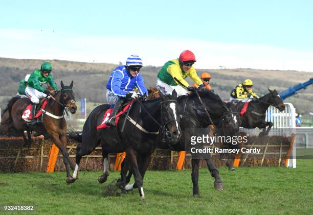 Cheltenham , United Kingdom - 15 March 2018; Penhill, left, with Paul Townend up, races alongside Supasundae, with Robbie Power up, who finished...