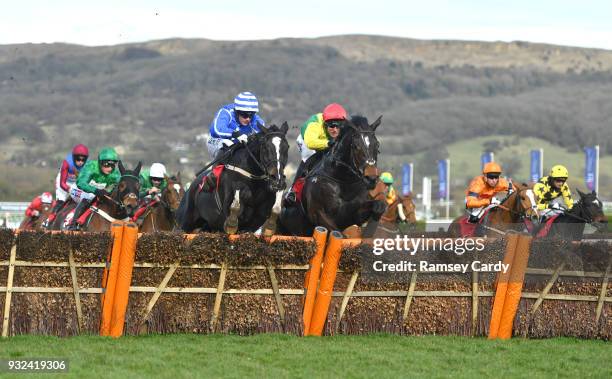 Cheltenham , United Kingdom - 15 March 2018; Penhill, left, with Paul Townend up, jumps the last alongside Supasundae, with Robbie Power up, who...