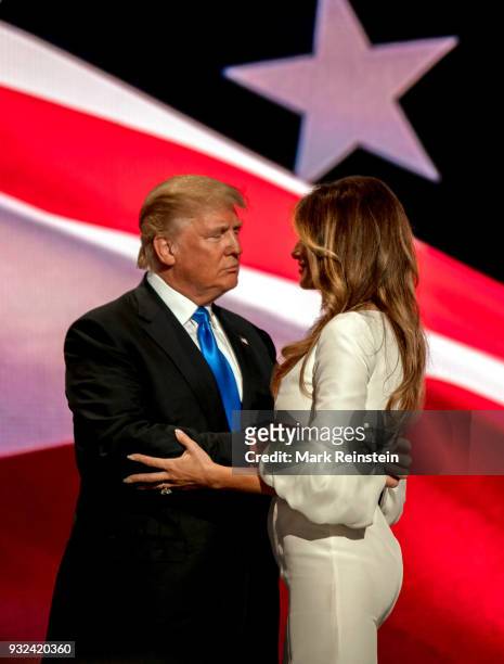View of American real estate developer and presidential candidate Donald Trump and his wife, former model Melania Trump, onstage on first night of...