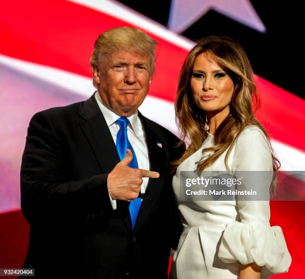 View of American real estate developer and presidential candidate Donald Trump and his wife, former model Melania Trump, onstage on first night of...