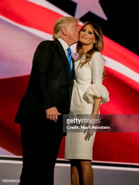 View of American real estate developer and presidential candidate Donald Trump and his wife, former model Melania Trump, onstage on first night of...