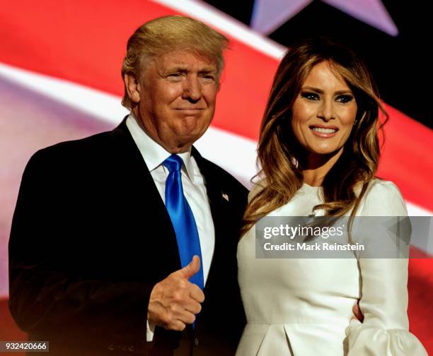 View of American real estate developer and presidential candidate Donald Trump and his wife, former model Melania Trump, onstage on first night of...