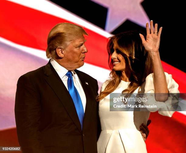 View of American real estate developer and presidential candidate Donald Trump and his wife, former model Melania Trump, onstage on first night of...