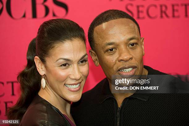 Record producer Dr. Dre and his wife Nicole arrive at the 2009 Victoria's Secret fashion show November 19, 2009 in New York. AFP PHOTO / DON EMMERT