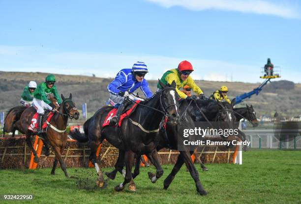 Cheltenham , United Kingdom - 15 March 2018; Penhill, left, with Paul Townend up, races alongside Supasundae, with Robbie Power up, who finished...