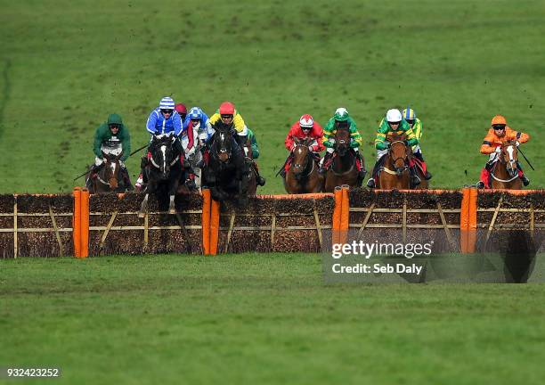 Cheltenham , United Kingdom - 15 March 2018; Penhill, left, with Paul Townend up, jumps the last alongside Supasundae, with Robbie Power up, on their...