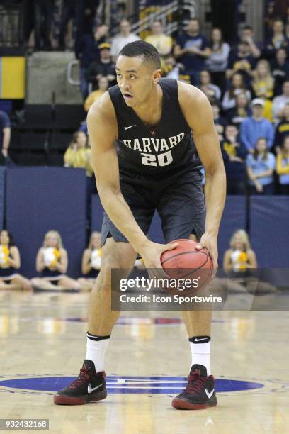 Harvard Crimson guard Justin Bassey watches a play develop during a National Invitation Tournament game between the Marquette Golden Eagles and the...