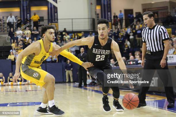 Harvard Crimson guard Christian Juzang makes a move during a National Invitation Tournament game between the Marquette Golden Eagles and the Harvard...