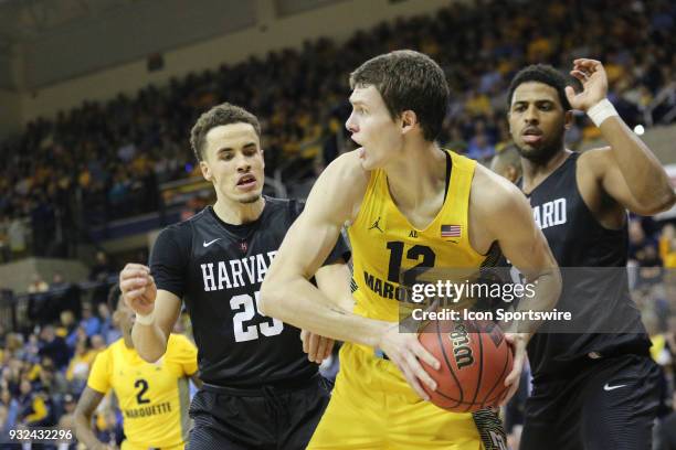 Marquette Golden Eagles center Matt Heldt battles a double team during a National Invitation Tournament game between the Marquette Golden Eagles and...