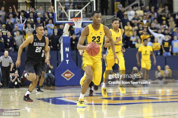 Marquette Golden Eagles forward Jamal Cain scores off a steal during a National Invitation Tournament game between the Marquette Golden Eagles and...