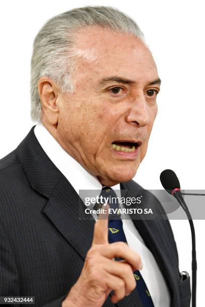 Brazilian President Michel Temer speaks during the signing ceremony of an agreement for the construction of a Bus Rapid Transit system in Goiania,...