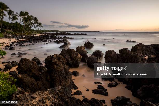 tropical sunset on makena beach in maui. - makena beach stock pictures, royalty-free photos & images