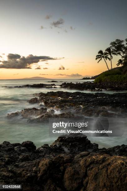 tropical sunset on makena beach in maui. - makena beach stock pictures, royalty-free photos & images