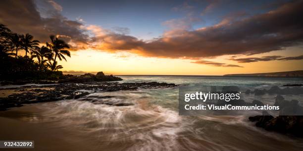 tropical sunset on makena beach in maui. - makena beach stock pictures, royalty-free photos & images