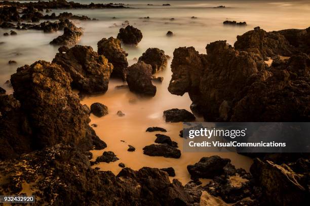 tropical sunset on makena beach in maui. - makena beach stock pictures, royalty-free photos & images