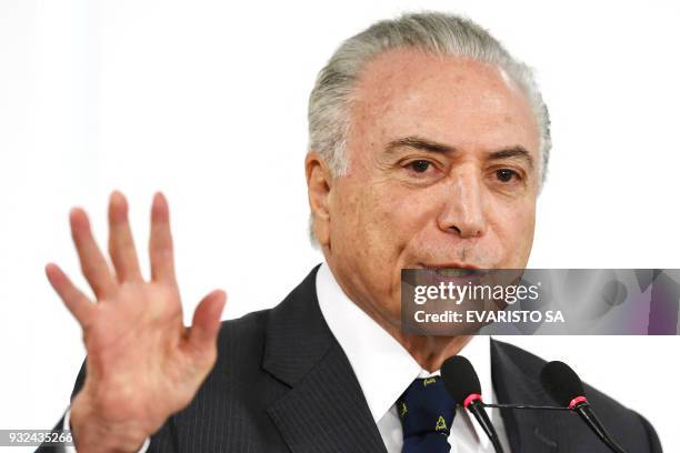 Brazilian President Michel Temer speaks during the signing ceremony of an agreement for the construction of a Bus Rapid Transit system in Goiania,...