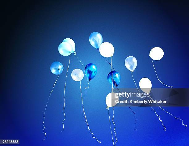 up into the clear blue sky - blue balloons stock pictures, royalty-free photos & images