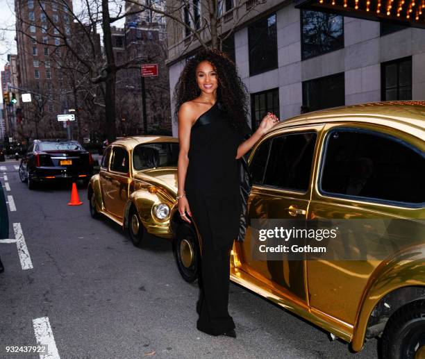 Ciara poses for photos in front of dual gold VW Beetles at Pandora Jewelry Shine collection launch on March 14, 2018 in New York City.