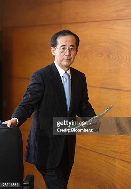 Masaaki Shirakawa, governor of the Bank of Japan, leaves a news conference in Tokyo, Japan, on Friday, Nov. 20, 2009. The Bank of Japan kept interest...