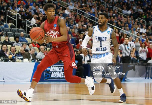 Rashard Odomes of the Oklahoma Sooners is chased by Jarvis Garrett of the Rhode Island Rams in the first half of the game during the first round of...