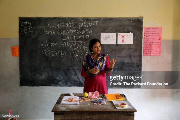 Teacher explains reproductive health systems to students at a village school. Through interactive methods, games, and discussions, the lessons are...